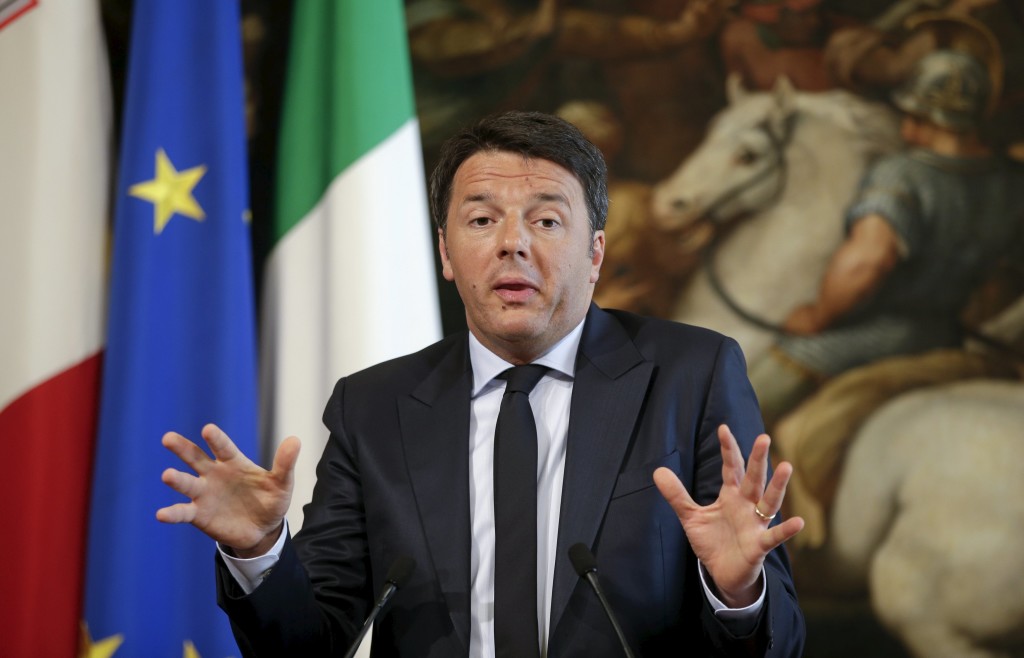 Italian Prime Minister Renzi gestures as he talks during a joint news conference with his Maltese counterpart Muscat at Chigi Palace in Rome